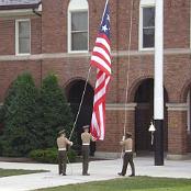 Lowering the flag.
