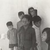 Corpsman Walter "Rip" Tyrrell at sick call for Vietnamese villagers - 1968. Photo courtesy of Mike Pepper.